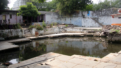 Temple tank of Anantagiri Kala Hanuman Temple, Rambagh Colony, Hyderabad, Vimanam of Ananthapadmanabha Swamy is seen left top corner